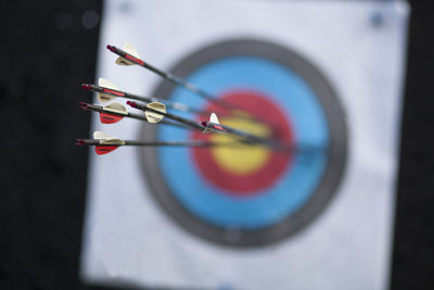 Close-up of arrow on dartboard