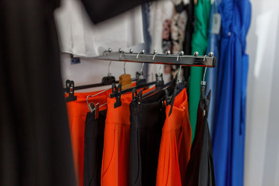 Close-up of clothes hanging on rack