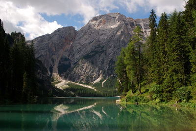 Scenic view of lake and mountains against sky