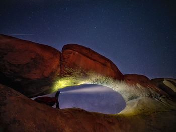 Scenic view of mountains against sky at night