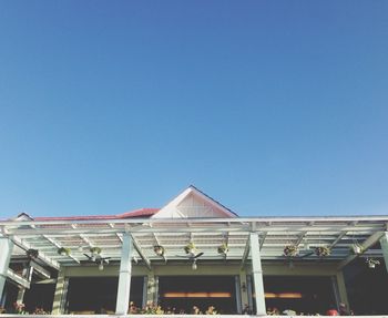 Exterior of cafe against clear sky