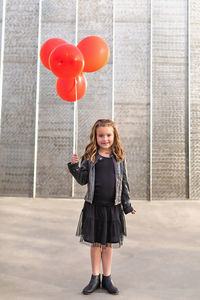 Full length portrait of a smiling girl