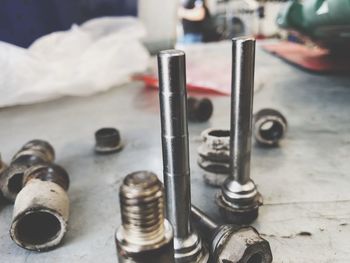 Close-up of machine parts on table