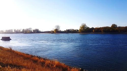 Scenic view of lake against clear sky