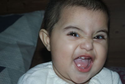 Close-up portrait of cute baby at home