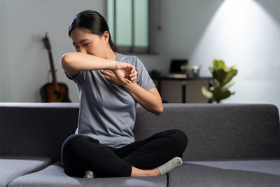 Young woman exercising at gym
