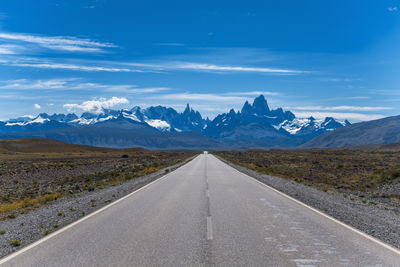 Straight road leading to mount fitzroy in the andes mountain range