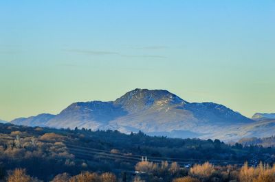 Scenic view of mountains against clear blue sky