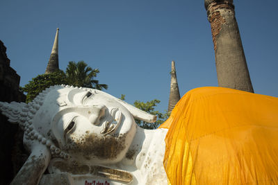 Close-up of reclining buddha statue in wat yai chai mongkhon temple