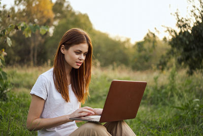 Young woman using digital tablet