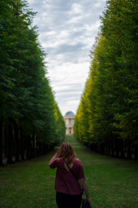 Rear view of woman standing in park