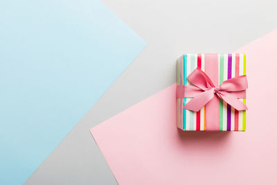 High angle view of gift box against blue background