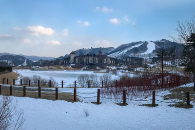 Scenic view of alpensia ski resort against cloudy sky, pyeongchang, south korea