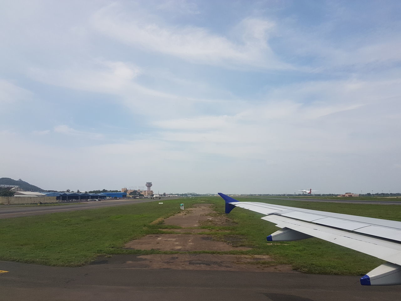 VIEW OF AIRPORT RUNWAY AGAINST SKY