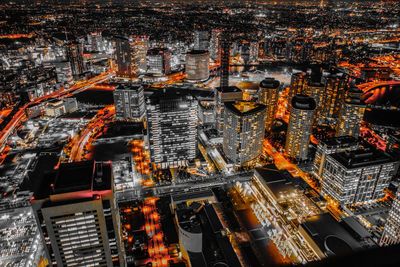 High angle view of illuminated buildings in city