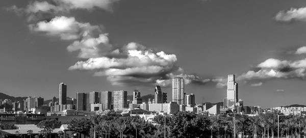 Panoramic shot of modern buildings against sky