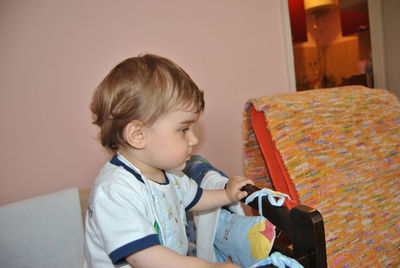 Cute boy sitting at home