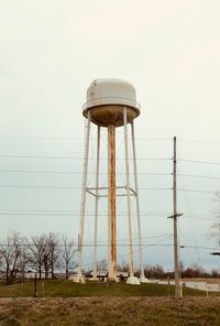 Low angle view of water tower against sky