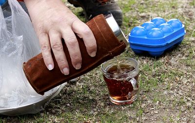 Close-up of man hand holding drink