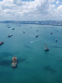 Off singapore's coast with ships, boats, tankers,  vessels the sea. high angle aerial view.