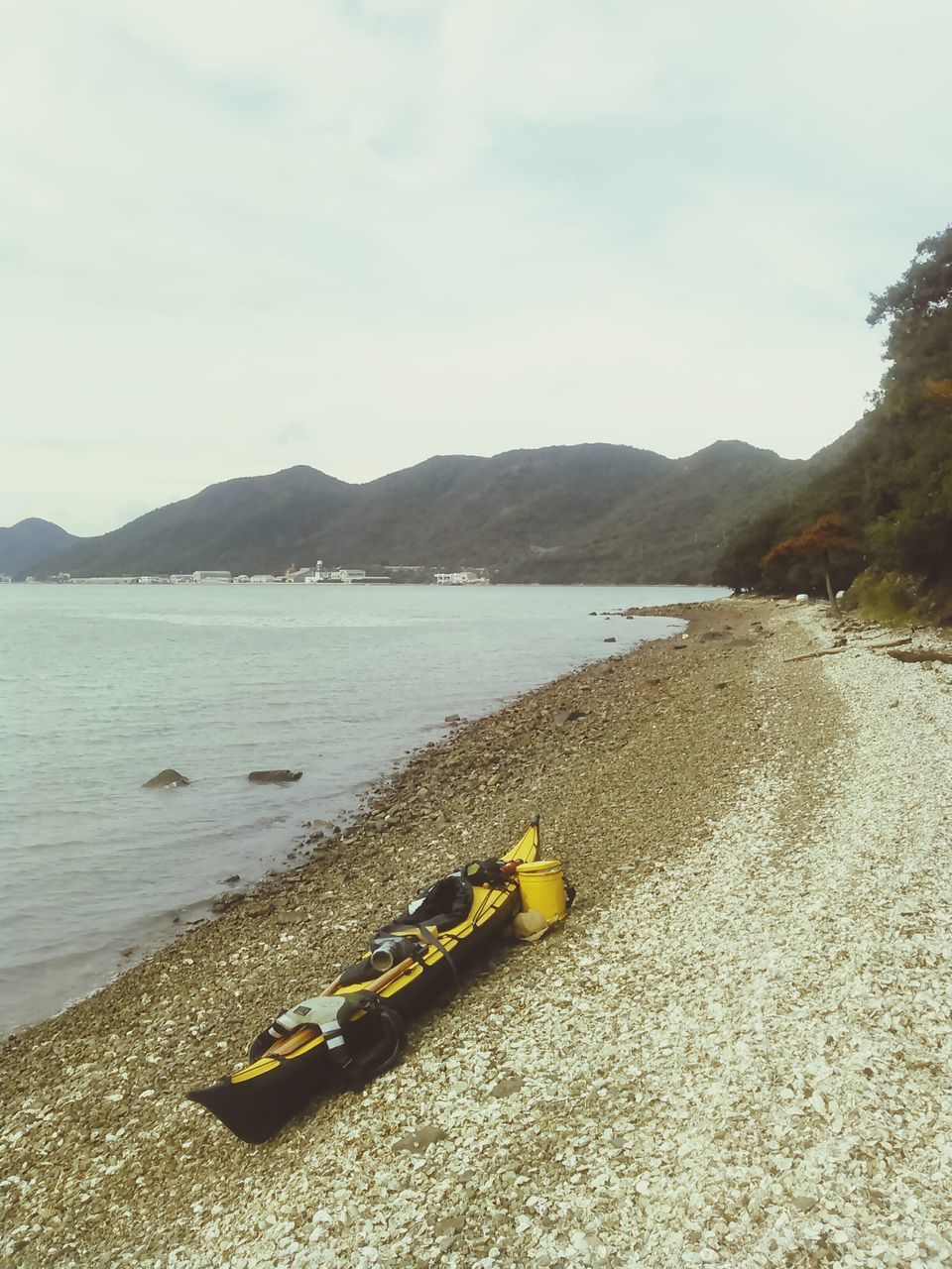 mountain, water, sky, tranquil scene, tranquility, scenics, beauty in nature, mountain range, nature, lake, beach, shore, sea, idyllic, cloud - sky, outdoors, non-urban scene, river, day, remote