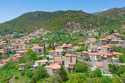 High angle view of townscape and mountains against sky