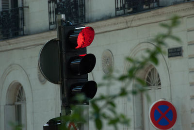 Close-up of road signs in city