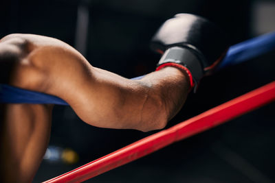 Low section of man exercising in gym