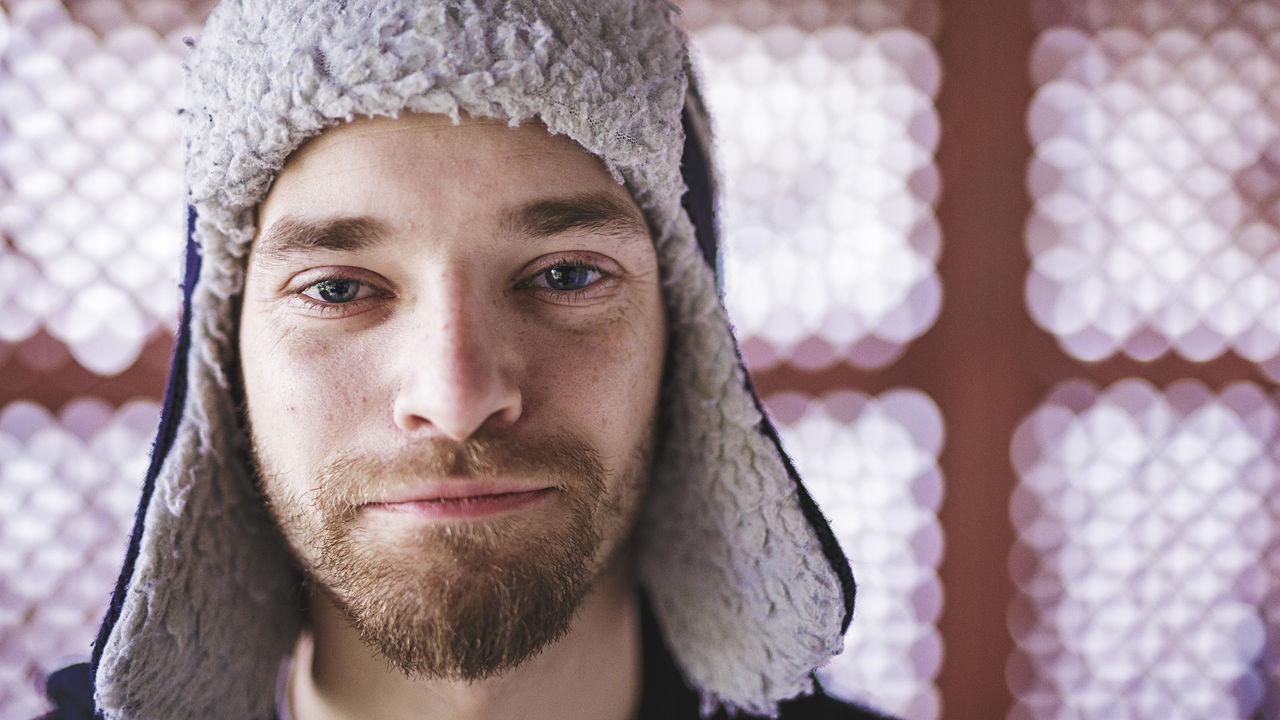 portrait, looking at camera, headshot, close-up, indoors, person, front view, human face, lifestyles, focus on foreground, young adult, young men, leisure activity, day, mid adult, contemplation, winter