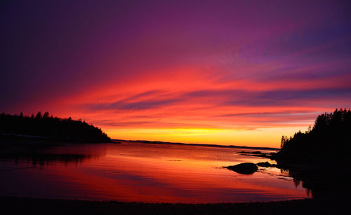 Scenic view of sea against orange sky