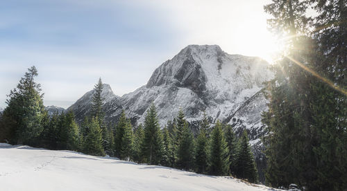 Scenic view of snowcapped mountains against sky