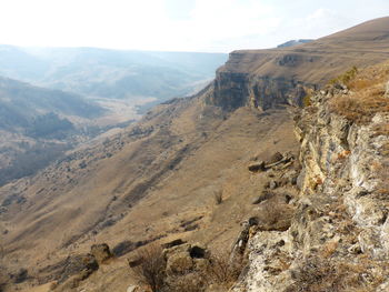 Scenic view of landscape and mountains against sky