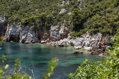 Scenic view of rocks by sea