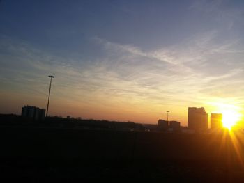 Cityscape against sky during sunset