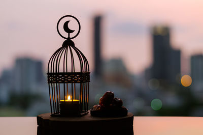 Close-up of illuminated candles on table