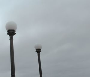 Low angle view of communications tower against sky