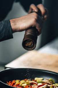 Close-up of chef preparing food in kitchen