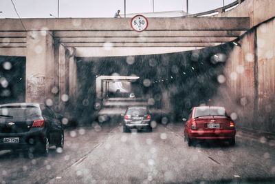 Cars on wet road in city