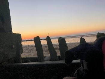 Scenic view of sea against clear sky during sunset