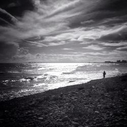 Scenic view of sea against cloudy sky