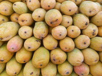 Full frame shot of mangoes at market stall for sale