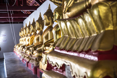 Statue of buddha in temple outside building