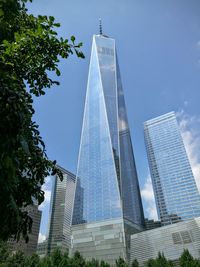 Low angle view of modern building against blue sky