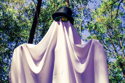 Low angle view of ghost standing on tree