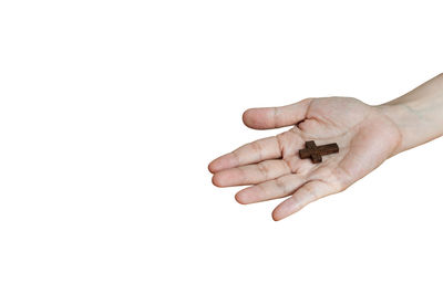 Close-up of hands holding over white background