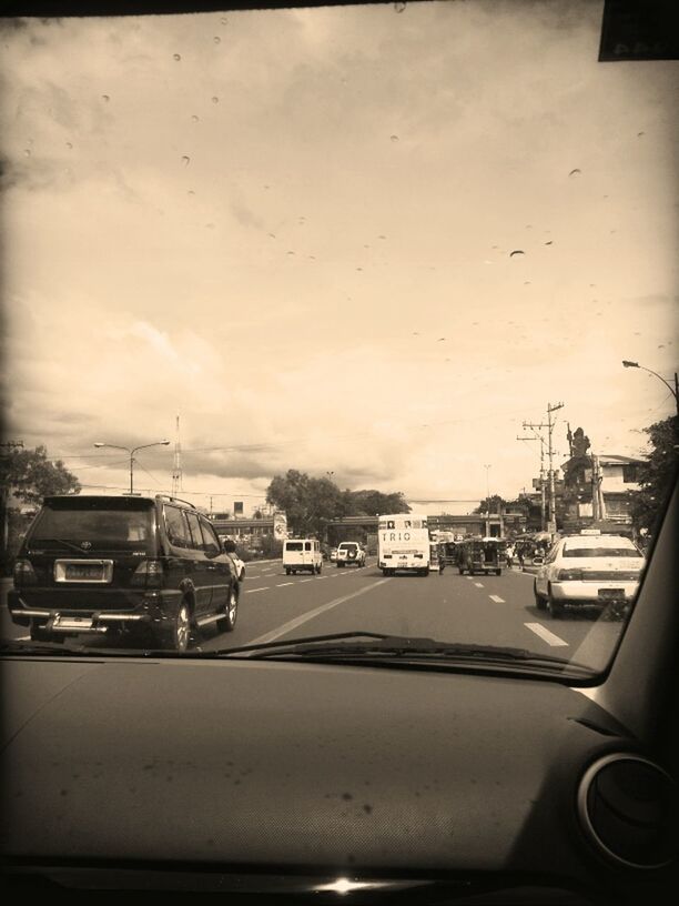 transportation, mode of transport, car, land vehicle, sky, vehicle interior, windshield, road, travel, on the move, car interior, cloud - sky, street, transparent, vehicle, airplane, glass - material, window, cloud, no people