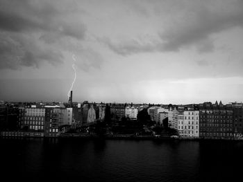 Cityscape against cloudy sky