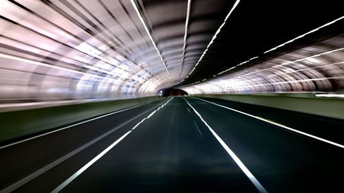 Blurred motion of illuminated subway station