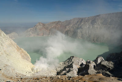 Panoramic view of volcanic landscape against sky