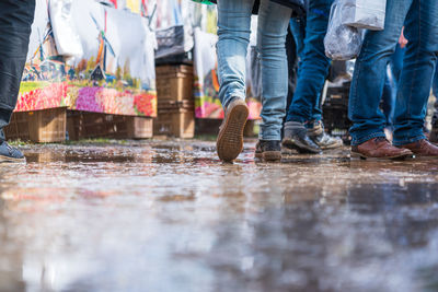 Low section of people standing in water